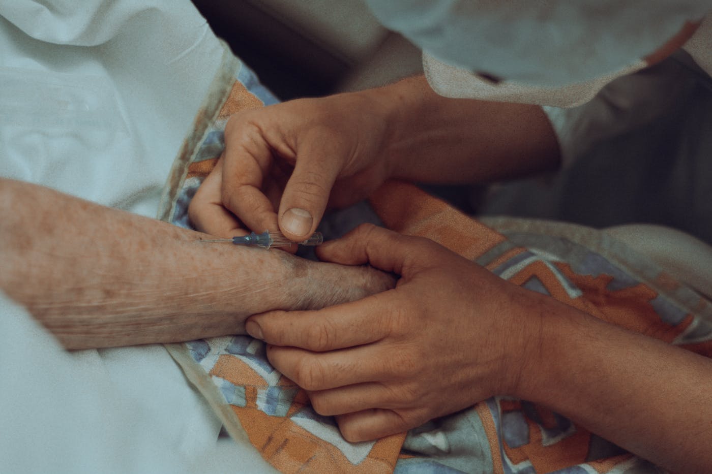 A caregiver holding a resident's hands