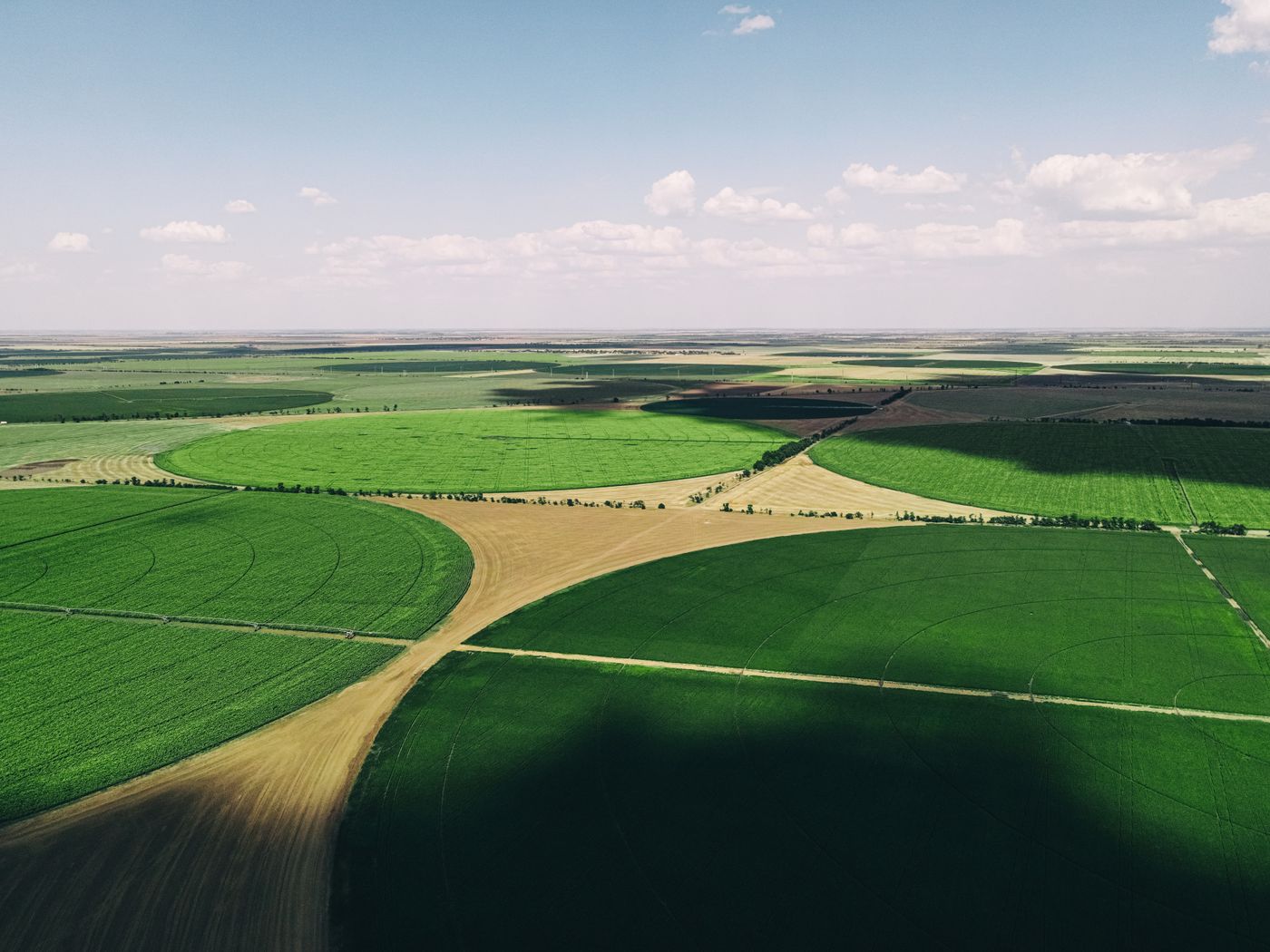 Aerial view of green Oklahoma farmland stretching to the horizon